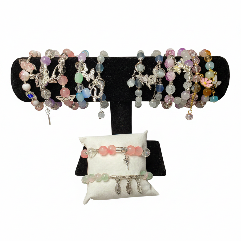 Pastel charm bracelets on white background
